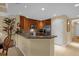 Modern kitchen with stainless steel appliances and granite countertops at 7650 Whisper Way # 203, Reunion, FL 34747