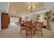 Elegant dining room with a round table and comfortable seating for four at 7650 Whisper Way # 203, Reunion, FL 34747