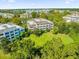 Aerial view of an apartment building and surrounding area at 7650 Whisper Way # 203, Reunion, FL 34747