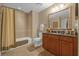 Bathroom with tub, shower, and single vanity at 7650 Whisper Way # 203, Reunion, FL 34747