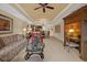 Comfortable living room with ample seating and a built-in entertainment center at 7650 Whisper Way # 203, Reunion, FL 34747