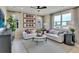 Relaxing living room featuring a white sofa and large windows at 1751 Carnelian St, Deland, FL 32720