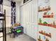 bedroom featuring a fun Mario theme, built in closet and small table at 270 Earlmont Pl, Davenport, FL 33896