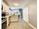 Modern kitchen with stainless steel appliances and white cabinetry at 270 Earlmont Pl, Davenport, FL 33896