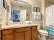 Bright bathroom with a large vanity and mirror, plus a toilet and shower at 270 Earlmont Pl, Davenport, FL 33896