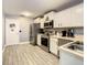 Clean and efficient kitchen featuring stainless steel appliances and white cabinetry at 270 Earlmont Pl, Davenport, FL 33896
