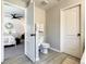 Clean bathroom with toilet and shower, conveniently located near bedroom at 270 Earlmont Pl, Davenport, FL 33896
