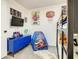 bedroom with bunk beds, a TV, and playful decor at 270 Earlmont Pl, Davenport, FL 33896