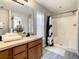 Bathroom with double vanity, shower, and modern finishes at 270 Earlmont Pl, Davenport, FL 33896