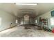 Large workshop with roll-up door and overhead lighting at 4121 Albritton Rd, St Cloud, FL 34772