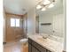 Clean bathroom with a shower, toilet and vanity with marble top at 4121 Albritton Rd, St Cloud, FL 34772