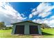 Two-car garage with dark brown roll-up doors at 4121 Albritton Rd, St Cloud, FL 34772