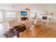 Spacious living room with hardwood floors, fireplace, and ample natural light at 4121 Albritton Rd, St Cloud, FL 34772