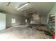 Spacious workshop interior with roll-up door and storage at 4121 Albritton Rd, St Cloud, FL 34772