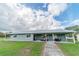 Ranch style home with covered patio and outdoor seating at 4121 Albritton Rd, St Cloud, FL 34772