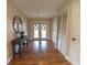 Elegant entrance hall with hardwood floors and a rustic console table at 4121 Albritton Rd, St Cloud, FL 34772