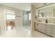 Spa-like bathroom with a frameless shower and double vanity at 4121 Albritton Rd, St Cloud, FL 34772