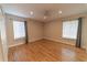 Bright bedroom featuring hardwood floors and ample natural light at 4121 Albritton Rd, St Cloud, FL 34772