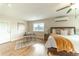 Large main bedroom with wood floors, a sitting area, and plenty of natural light at 4121 Albritton Rd, St Cloud, FL 34772