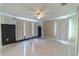 Well-lit bedroom with tile floors and ceiling fan at 4121 Albritton Rd, St Cloud, FL 34772