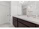 Bathroom with double vanity and large mirror at 4919 Conifer Cone Dr, Kissimmee, FL 34746