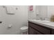 Clean bathroom with dark vanity and updated fixtures at 4919 Conifer Cone Dr, Kissimmee, FL 34746