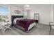 Main bedroom with large bed, window, and ceiling fan at 4919 Conifer Cone Dr, Kissimmee, FL 34746