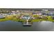 Community pool and lakefront amenity area with surrounding homes at 4919 Conifer Cone Dr, Kissimmee, FL 34746