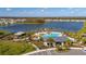 Resort-style pool with expansive lake views and community playground at 4919 Conifer Cone Dr, Kissimmee, FL 34746