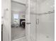 Bathroom with shower and view into bedroom at 4919 Conifer Cone Dr, Kissimmee, FL 34746