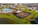 Community playground with shaded play area near lake at 4919 Conifer Cone Dr, Kissimmee, FL 34746