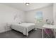 Charming bedroom with window and decorative wall art at 4919 Conifer Cone Dr, Kissimmee, FL 34746