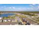 Community overview featuring lake, homes and amenities at 4919 Conifer Cone Dr, Kissimmee, FL 34746