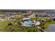 Aerial view of community pool and surrounding homes at 4919 Conifer Cone Dr, Kissimmee, FL 34746