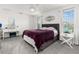 Main bedroom with a large bed and window at 4919 Conifer Cone Dr, Kissimmee, FL 34746