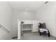 Bright upstairs landing with built-in desk and comfortable chair at 4919 Conifer Cone Dr, Kissimmee, FL 34746