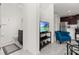 Open living space with TV, seating, and adjacent bathroom at 4919 Conifer Cone Dr, Kissimmee, FL 34746