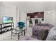 Spacious living room with comfy seating and kitchen views at 4919 Conifer Cone Dr, Kissimmee, FL 34746
