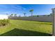 Spacious backyard with grassy lawn and privacy fence at 4919 Conifer Cone Dr, Kissimmee, FL 34746