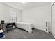 Bright bedroom with window, carpet, and a bed at 4919 Conifer Cone Dr, Kissimmee, FL 34746
