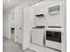 Laundry room with washer, dryer, and shelving at 4919 Conifer Cone Dr, Kissimmee, FL 34746