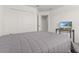 Bedroom with a large bed, closet and TV at 4919 Conifer Cone Dr, Kissimmee, FL 34746