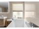 Relaxing bathroom with soaking tub and large window at 632 Pinewood Dr, Davenport, FL 33896