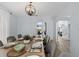 Dining room with large table and view into Gathering room at 632 Pinewood Dr, Davenport, FL 33896