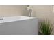 Close up of a soaking tub with modern fixtures at 632 Pinewood Dr, Davenport, FL 33896