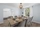 Formal dining room with large table and gray chairs at 632 Pinewood Dr, Davenport, FL 33896