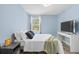 Light blue bedroom with a full bed, and a flat screen TV at 632 Pinewood Dr, Davenport, FL 33896