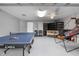 Fun game room with ping pong table, basketball game, and crib at 632 Pinewood Dr, Davenport, FL 33896