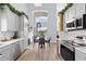Modern kitchen with stainless steel appliances and eat-in dining area at 632 Pinewood Dr, Davenport, FL 33896