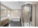 Modern bathroom with soaking tub and walk-in shower at 632 Pinewood Dr, Davenport, FL 33896